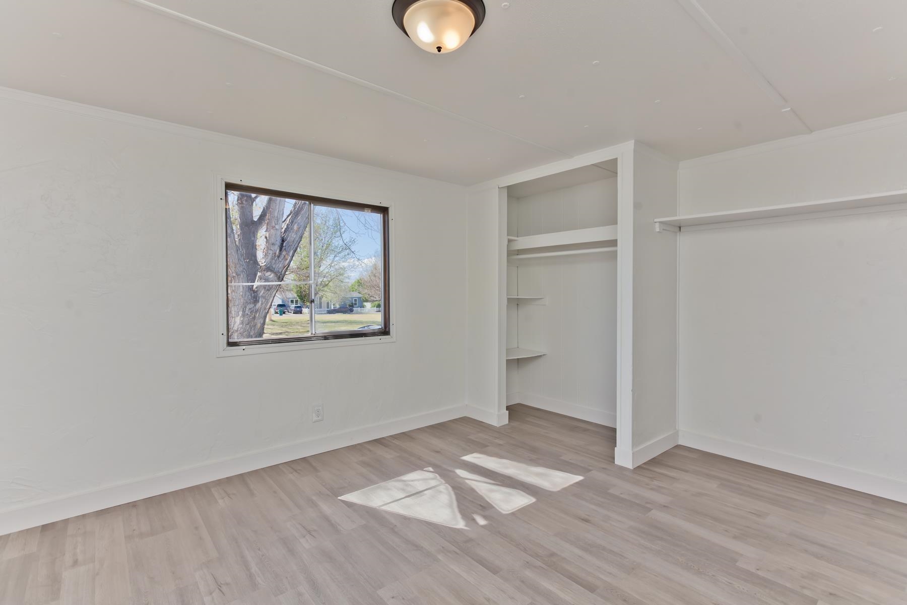 432 Pisces Circle Fruita, CO 81521 - Photo 36 of 40 a view of a room with wooden floor and window