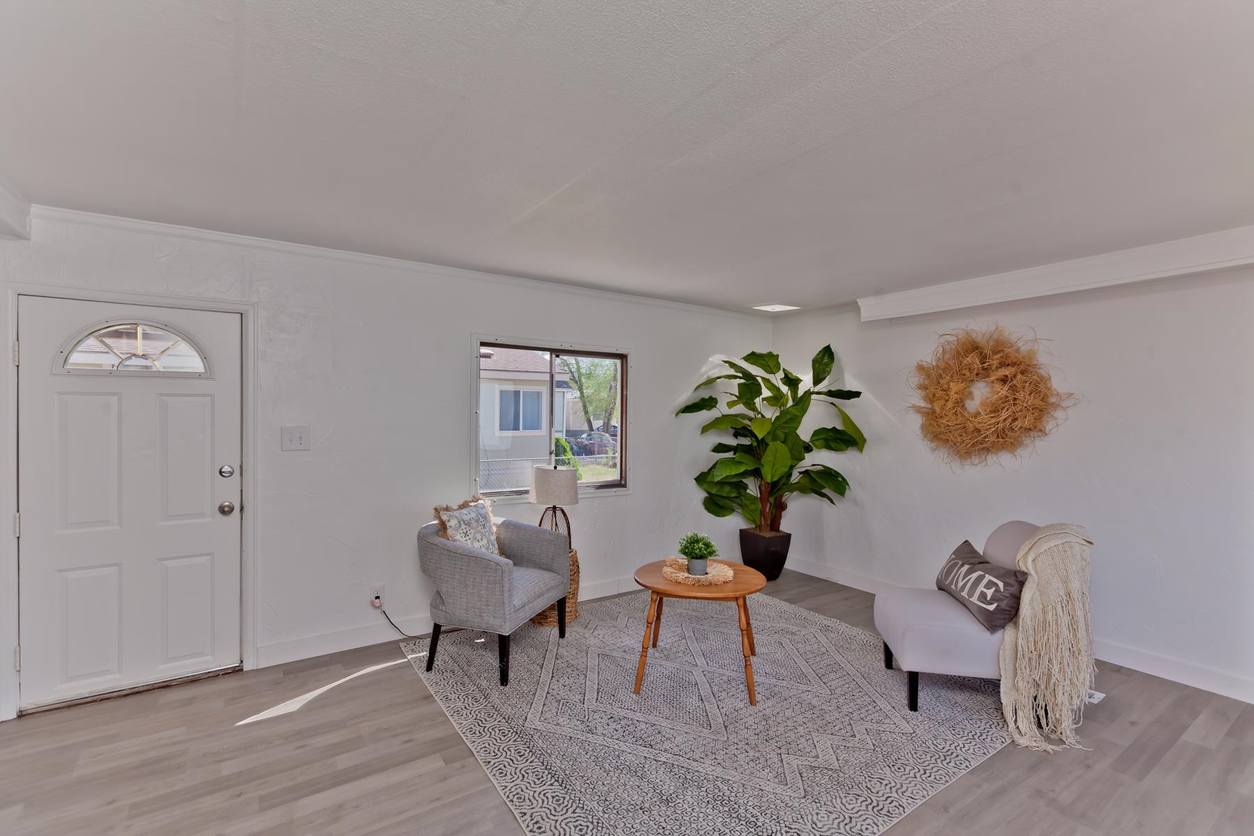 432 Pisces Circle Fruita, CO 81521 - Photo 4 of 40 a living room with furniture and a potted plant