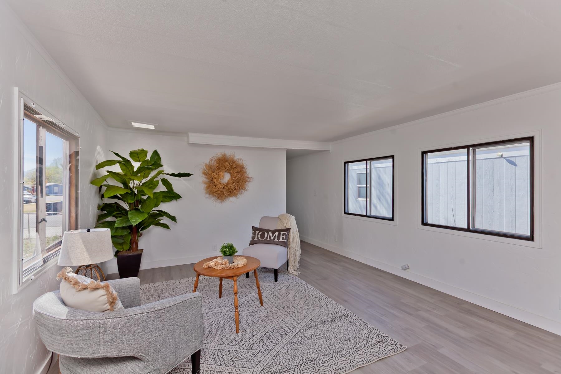 432 Pisces Circle Fruita, CO 81521 - Photo 5 of 40 a living room with furniture flowerpot and wooden floor