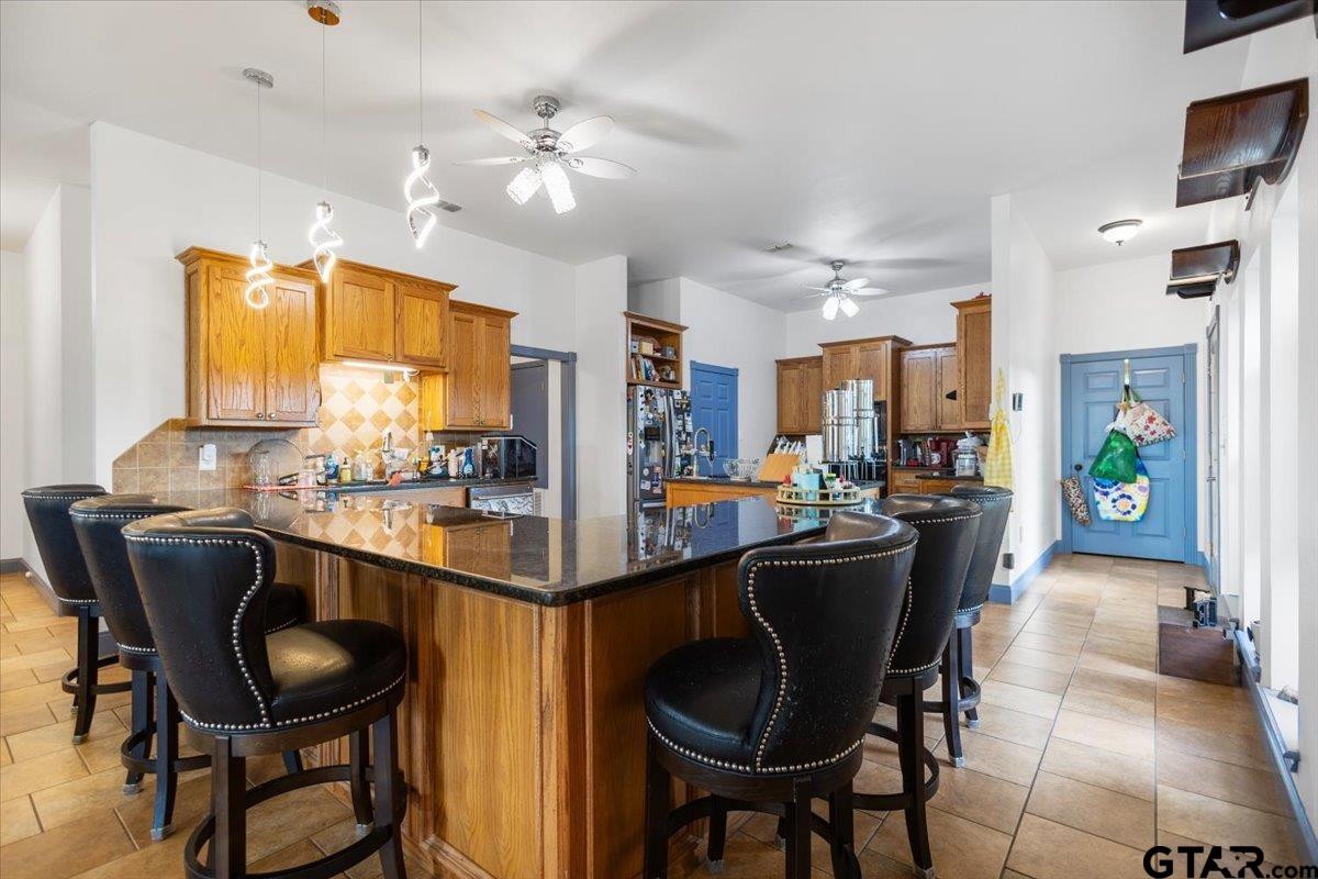 15515 County Road 434 Lindale, TX 75771 - Photo 13 of 46 a dining table with chairs and chandelier