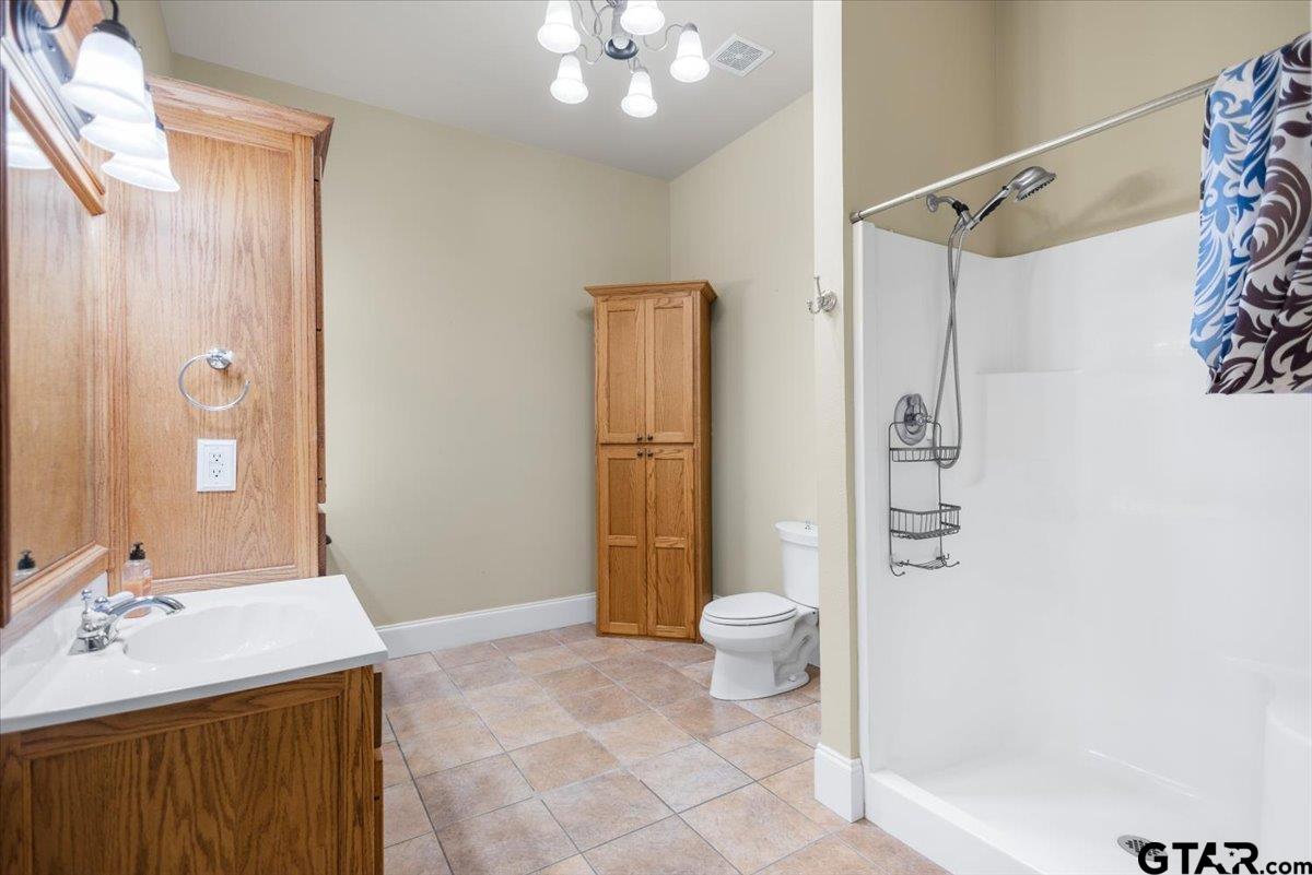 15515 County Road 434 Lindale, TX 75771 - Photo 23 of 46 a bathroom with a sink a toilet and shower