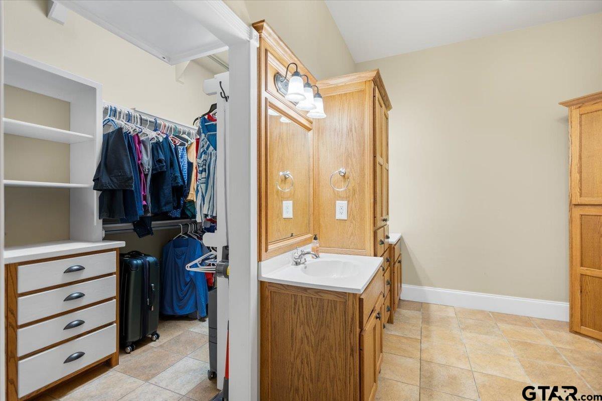 15515 County Road 434 Lindale, TX 75771 - Photo 24 of 46 a view of walk in closet with clothes