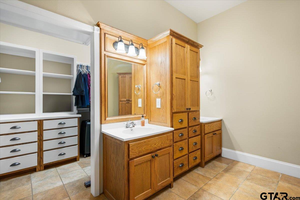 15515 County Road 434 Lindale, TX 75771 - Photo 25 of 46 a bathroom with a double vanity sink mirror and