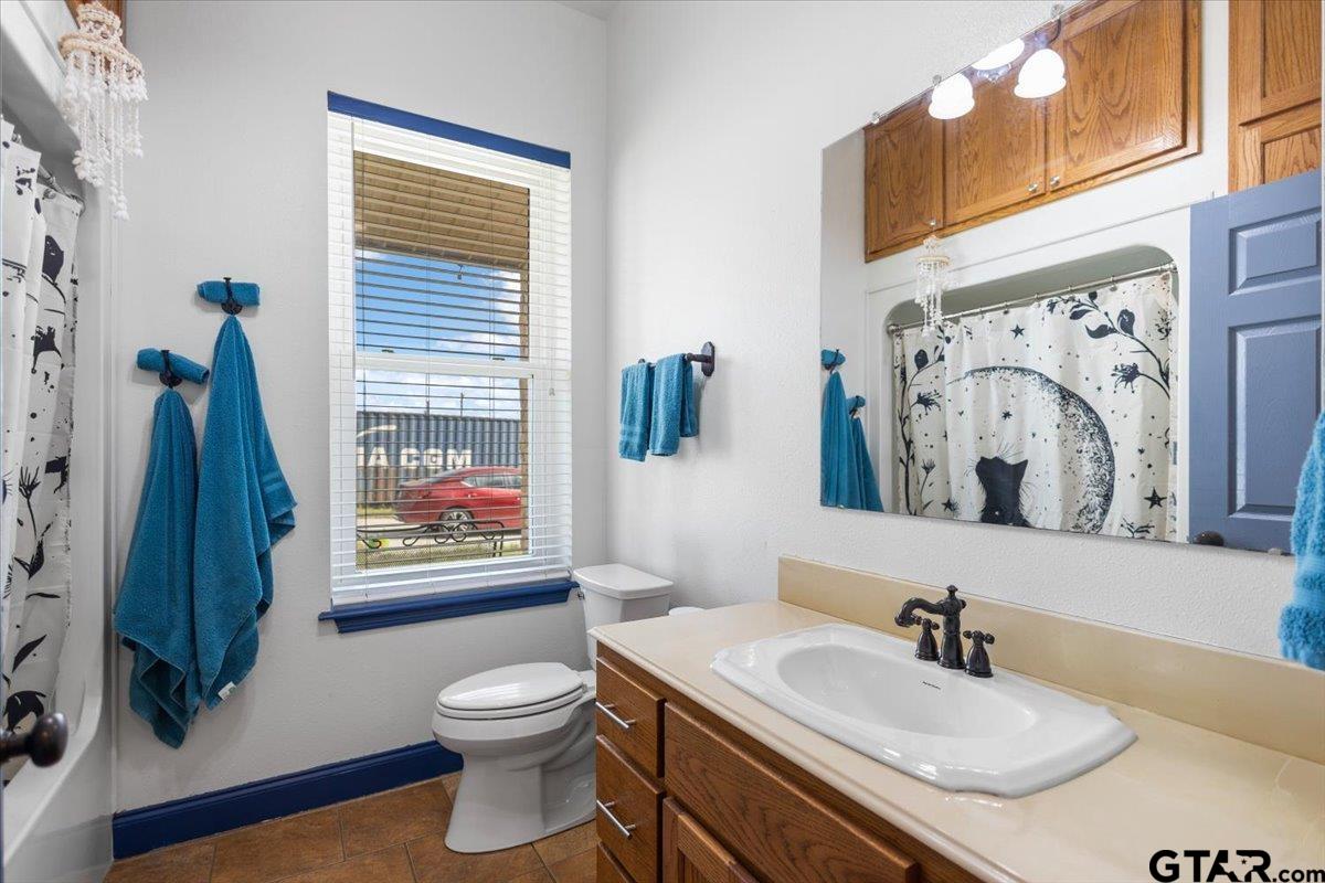 15515 County Road 434 Lindale, TX 75771 - Photo 29 of 46 a bathroom with a toilet sink and mirror