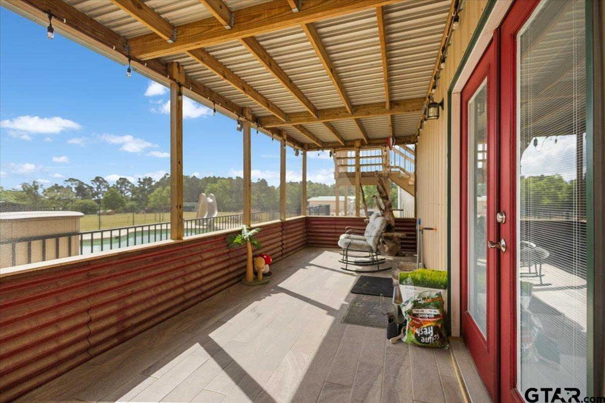 15515 County Road 434 Lindale, TX 75771 - Photo 37 of 46 a porch with wooden floor next to a yard