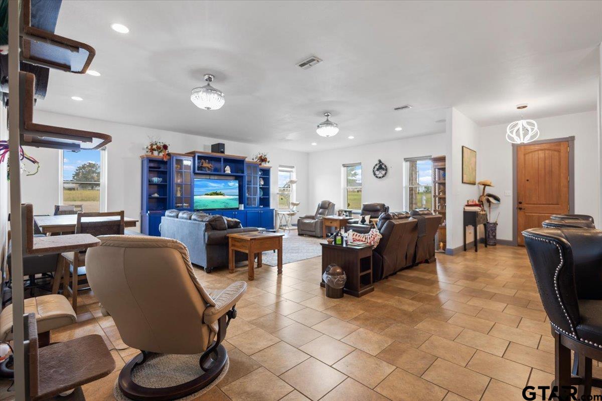 15515 County Road 434 Lindale, TX 75771 - Photo 5 of 46 a living room with furniture kitchen view and a large window