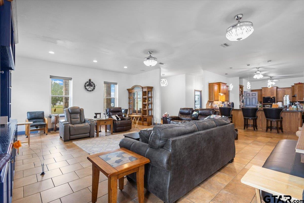 15515 County Road 434 Lindale, TX 75771 - Photo 6 of 46 a living room with furniture kitchen view and a chandelier