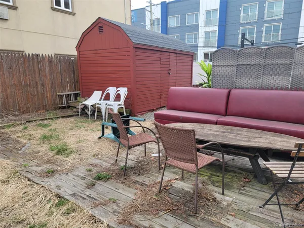 a patio with table and chairs