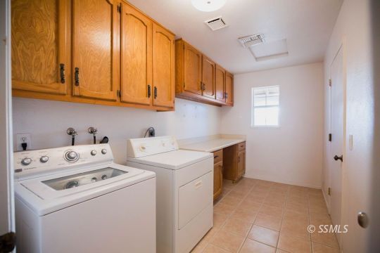 2007 Pickrell Street Ridgecrest, CA 93555 - Photo 27 of 37 a utility room with dryer and washer