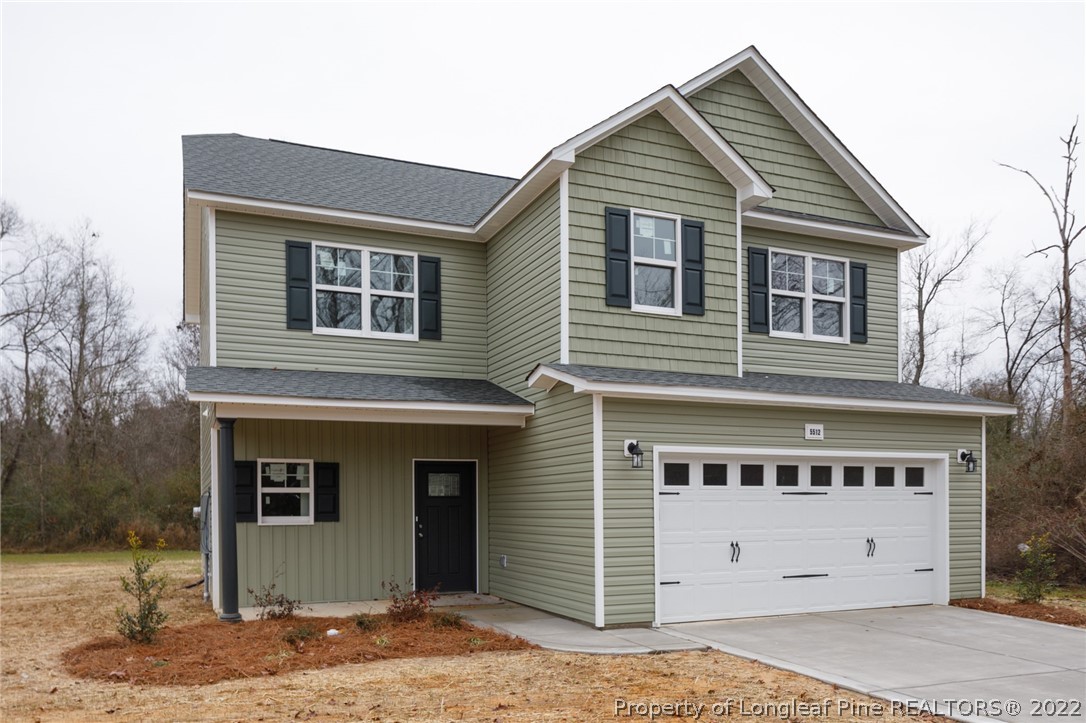 5512 Tolarsville Road St. Pauls, NC 28384 - Photo 2 of 5 a front view of a house with a yard