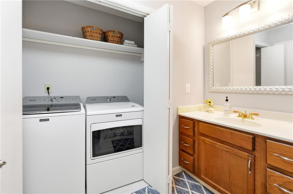 604 Mill Pond Road, Unit 604 Roswell, GA 30076 - Photo 23 of 28 a utility room with sink washer and dryer