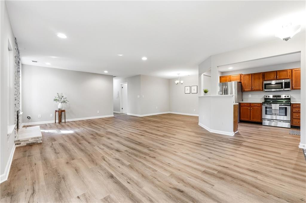 604 Mill Pond Road, Unit 604 Roswell, GA 30076 - Photo 6 of 28 a view of kitchen and a microwave
