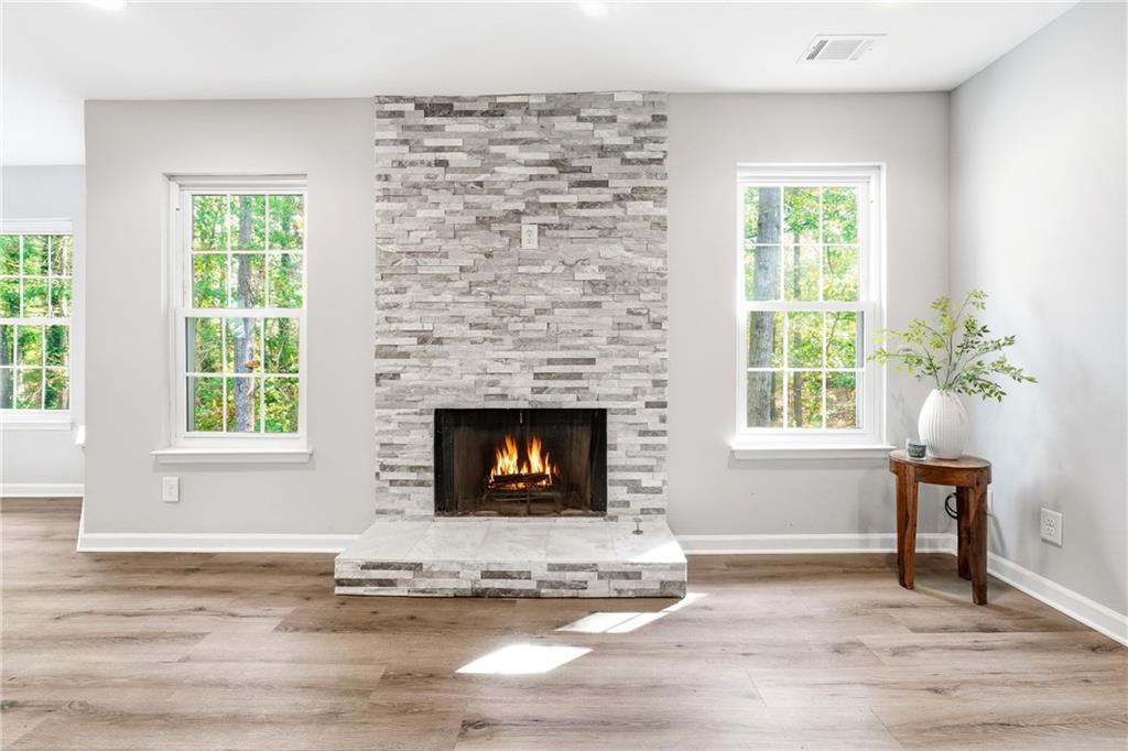 604 Mill Pond Road, Unit 604 Roswell, GA 30076 - Photo 7 of 28 a living room with furniture and a fireplace