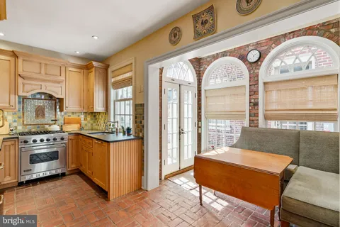 a kitchen with stainless steel appliances granite countertop a stove and a refrigerator