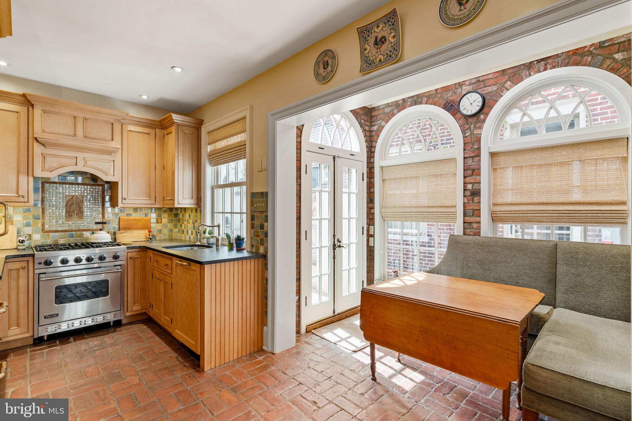 228 Spruce Street Philadelphia, PA 19106 - Photo 11 of 36 a kitchen with stainless steel appliances granite countertop a stove and a refrigerator