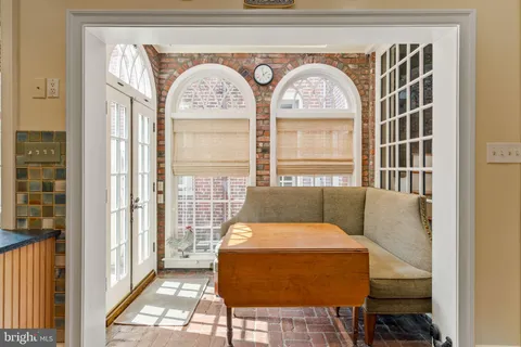 a view of hall way with furniture
