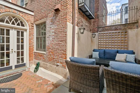 a view of a brick building with many windows