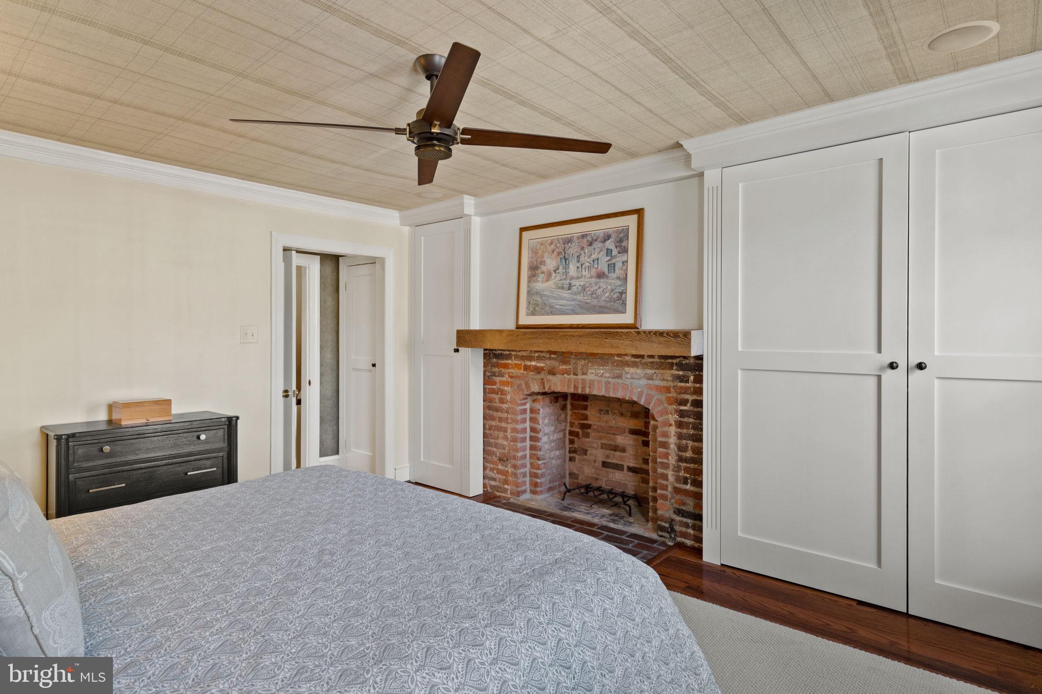 228 Spruce Street Philadelphia, PA 19106 - Photo 21 of 36 a bedroom with furniture and a fireplace