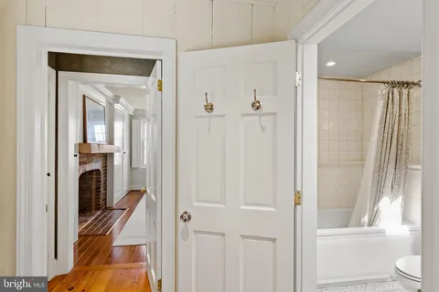 a view of a bathroom from a hallway