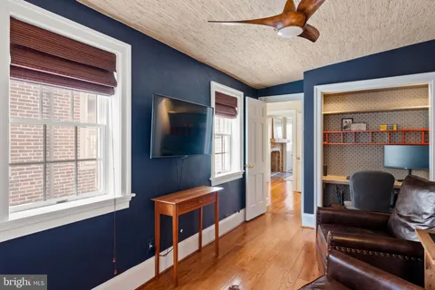 a view of hall way with furniture and rug