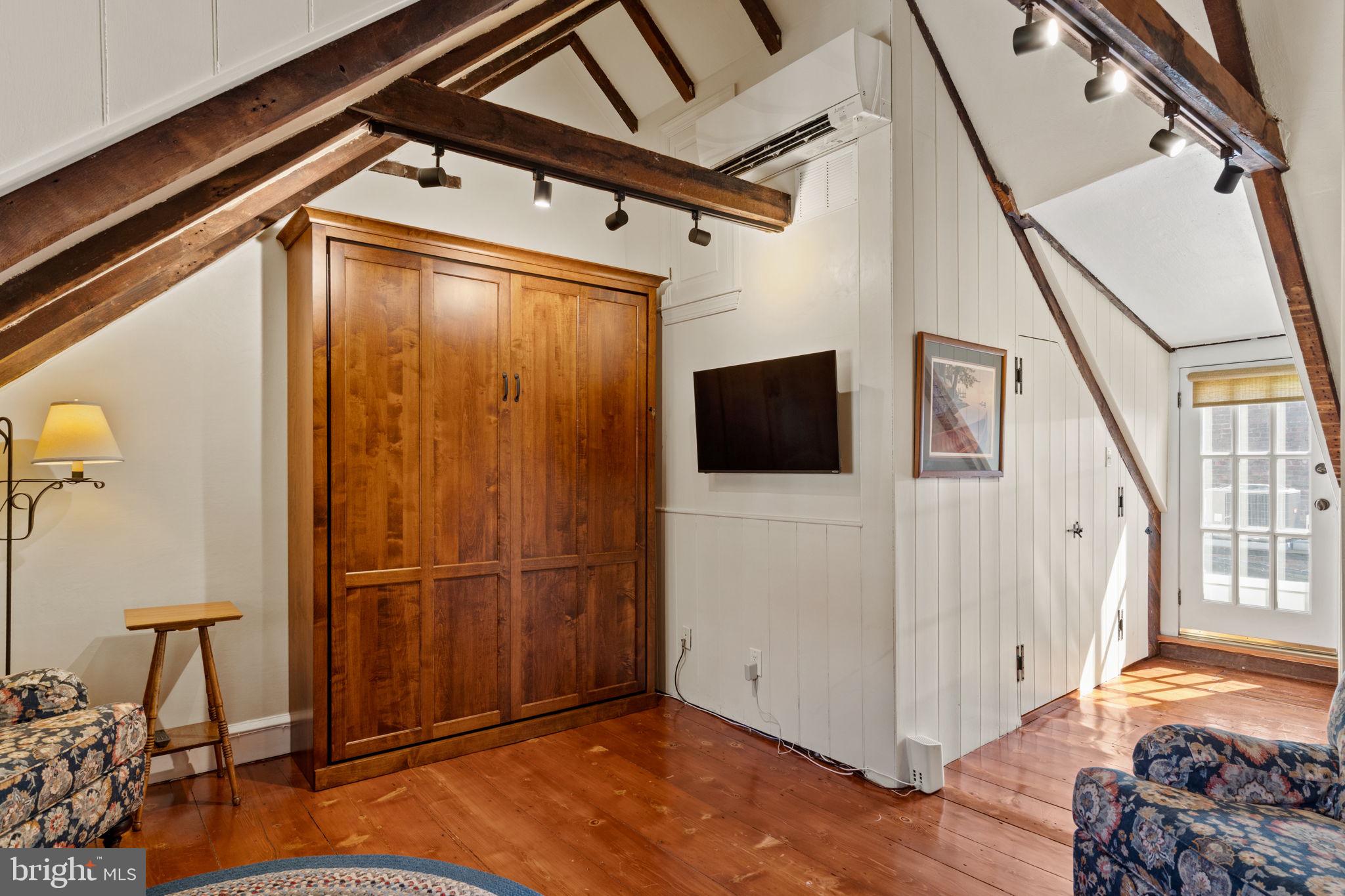 228 Spruce Street Philadelphia, PA 19106 - Photo 31 of 36 a view of a livingroom with wooden floor and stairs