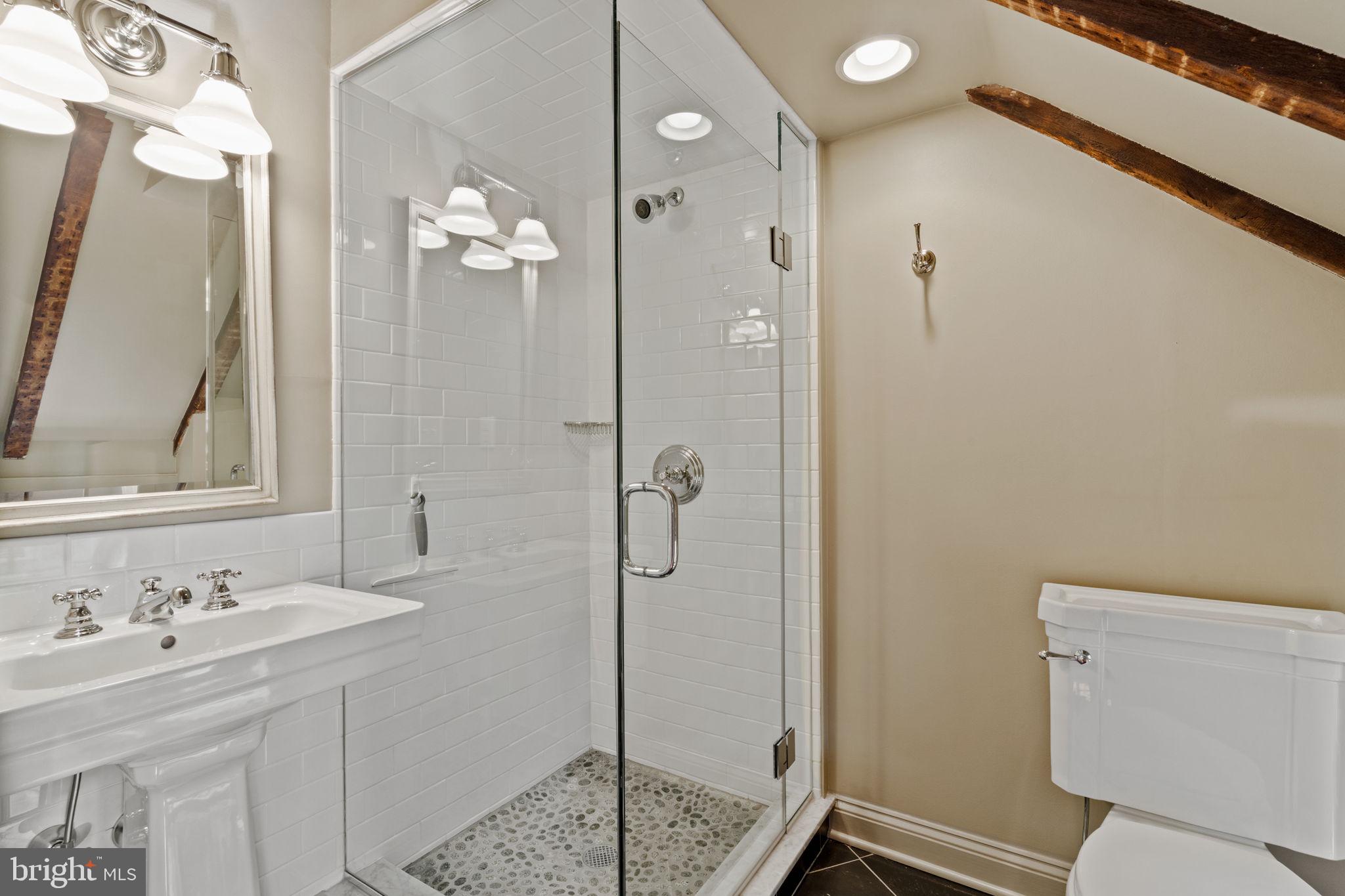 228 Spruce Street Philadelphia, PA 19106 - Photo 34 of 36 a bathroom with a sink a toilet and shower