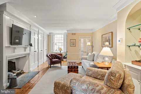 a bedroom with furniture and a fireplace