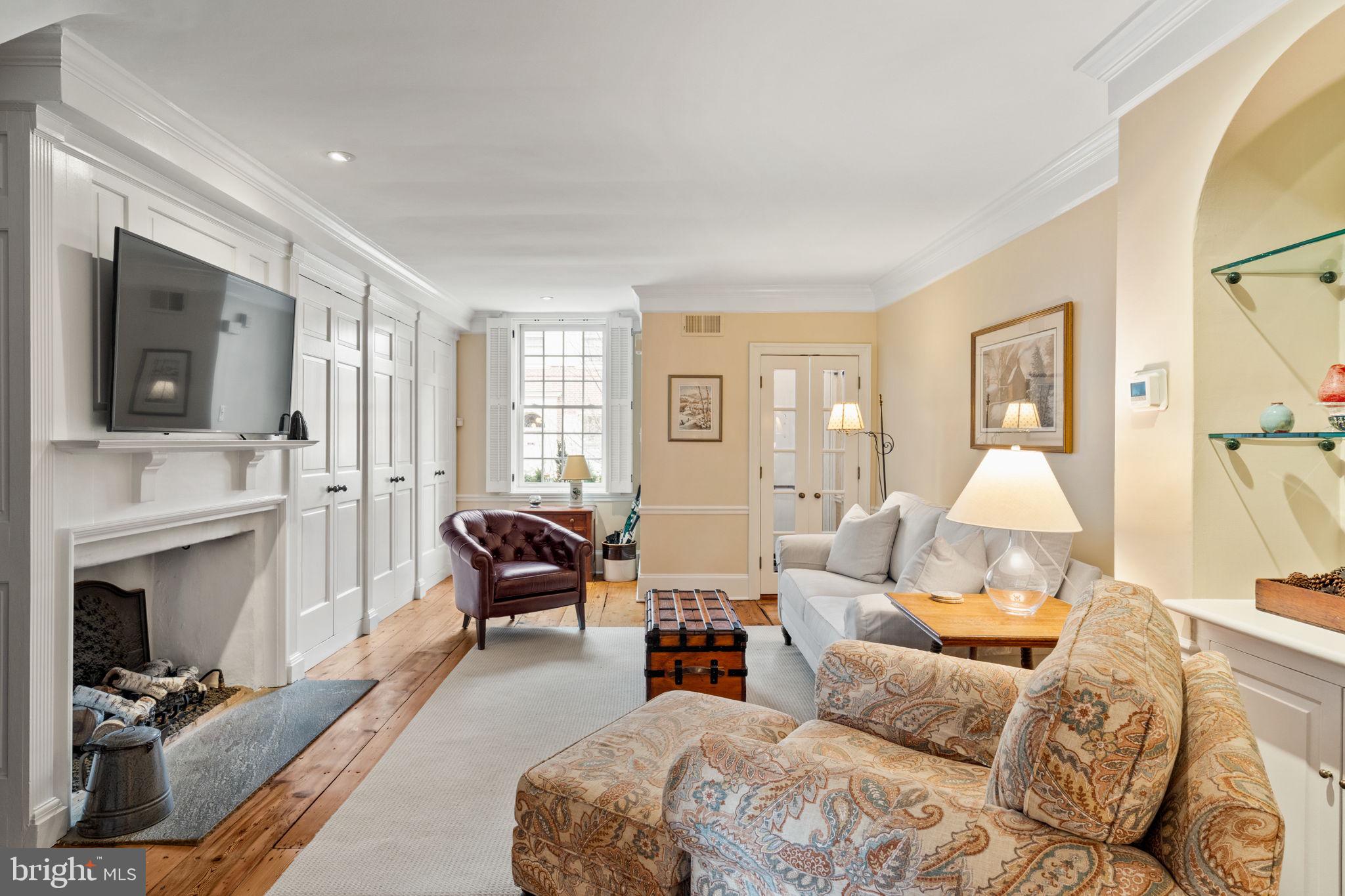 228 Spruce Street Philadelphia, PA 19106 - Photo 4 of 36 a bedroom with furniture and a fireplace