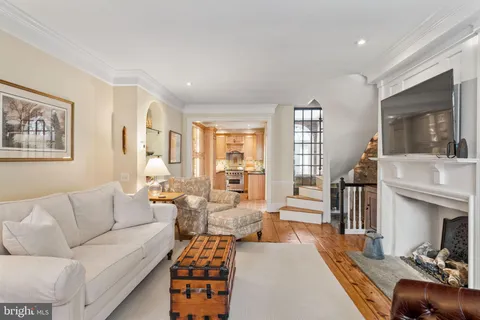 a living room with furniture fireplace and flat screen tv