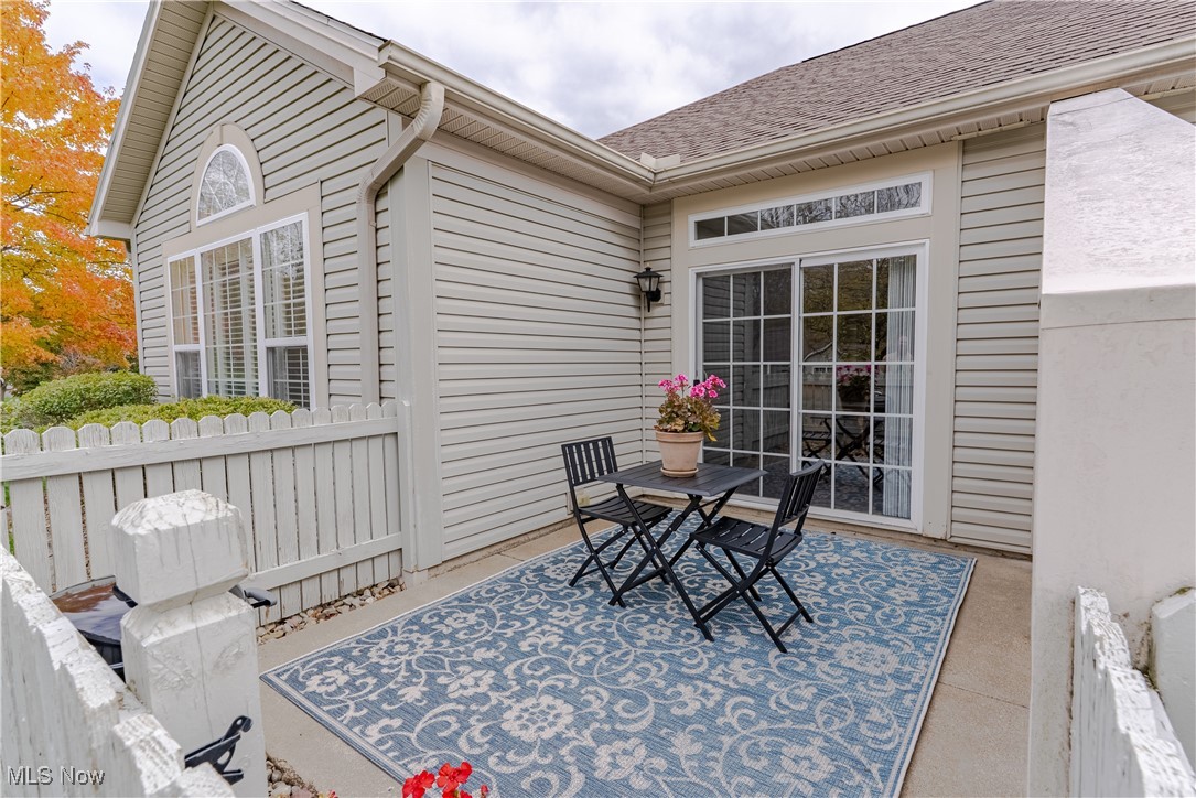 5645 Clingan Road, Unit 23B Struthers, OH 44471 - Photo 31 of 38 Wooden deck with outdoor dining area and a patio area