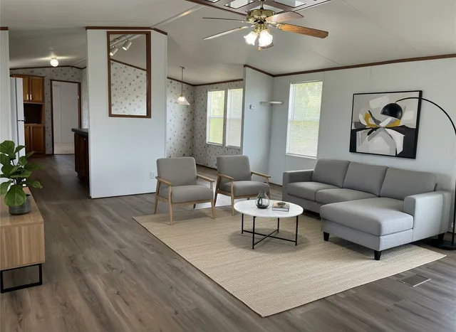 a living room with furniture and a large window