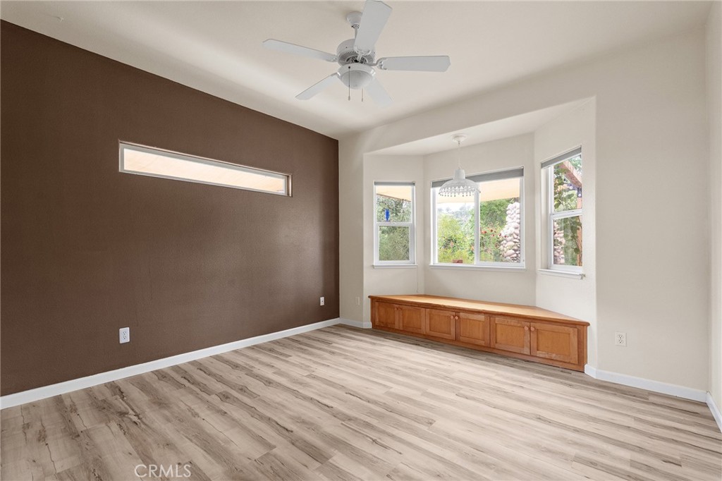 2262 Honey Run Road Chico, CA 95928 - Photo 23 of 74 an empty room with wooden floor and windows