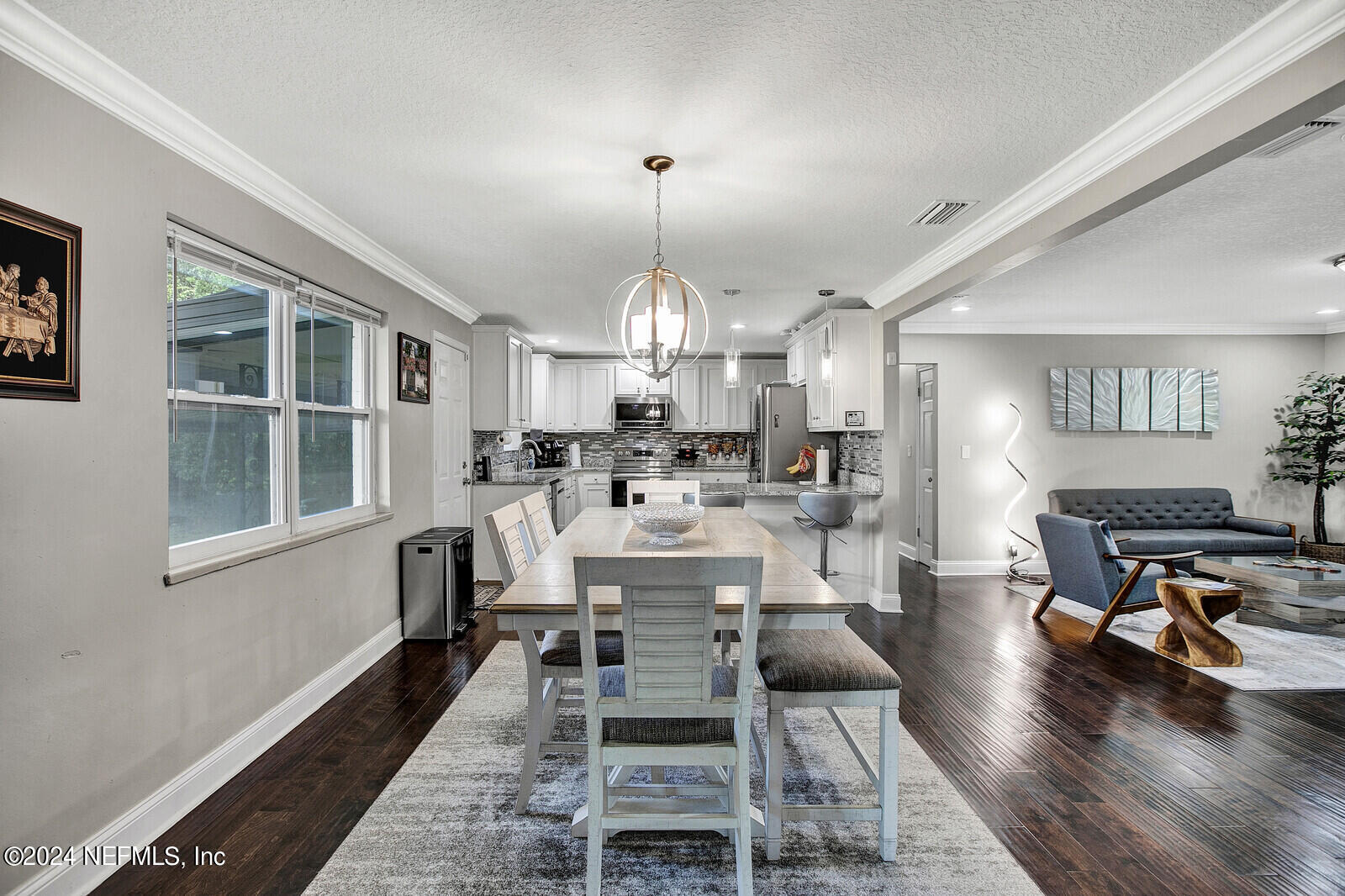 2907 Ribault Scenic Drive Jacksonville, FL 32208 - Photo 12 of 49 a view of a dining room with furniture window and wooden floor