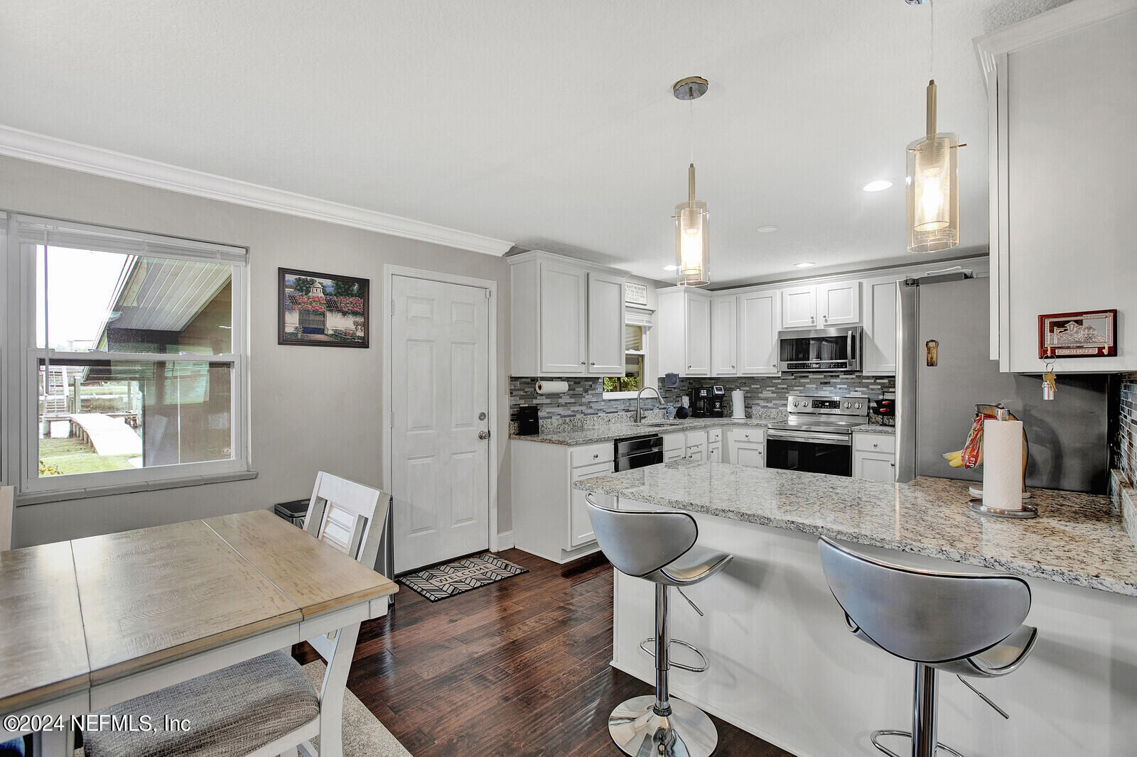 2907 Ribault Scenic Drive Jacksonville, FL 32208 - Photo 18 of 49 a kitchen with stainless steel appliances granite countertop sink refrigerator and cabinets