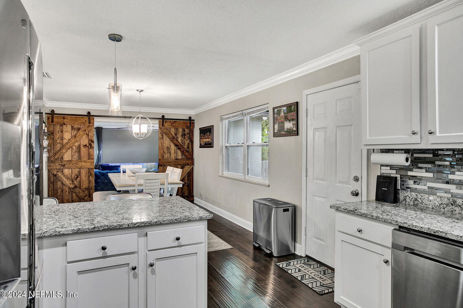 2907 Ribault Scenic Drive Jacksonville, FL 32208 - Photo 21 of 49 a kitchen with stainless steel appliances granite countertop a sink refrigerator and cabinets