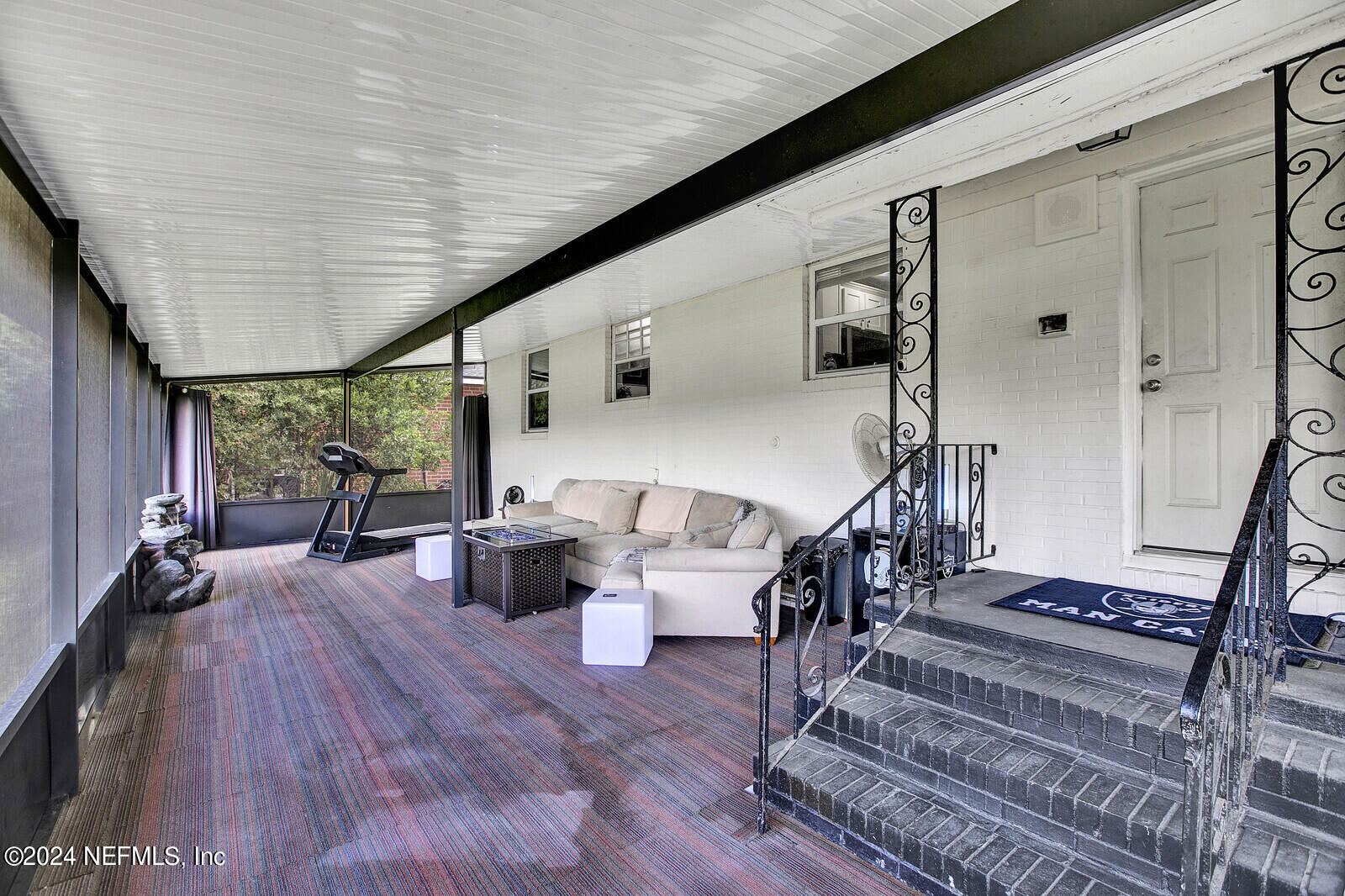 2907 Ribault Scenic Drive Jacksonville, FL 32208 - Photo 30 of 49 a dining room with wooden floor and stairs
