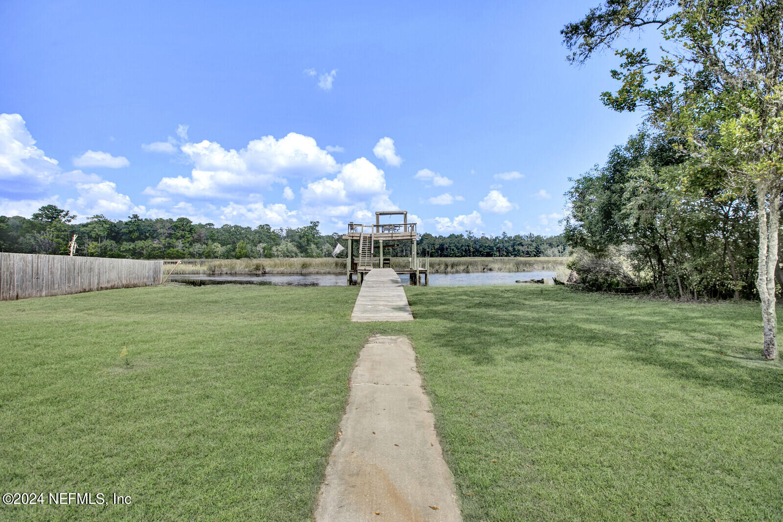2907 Ribault Scenic Drive Jacksonville, FL 32208 - Photo 37 of 49 a swimming pool with outdoor seating and garden