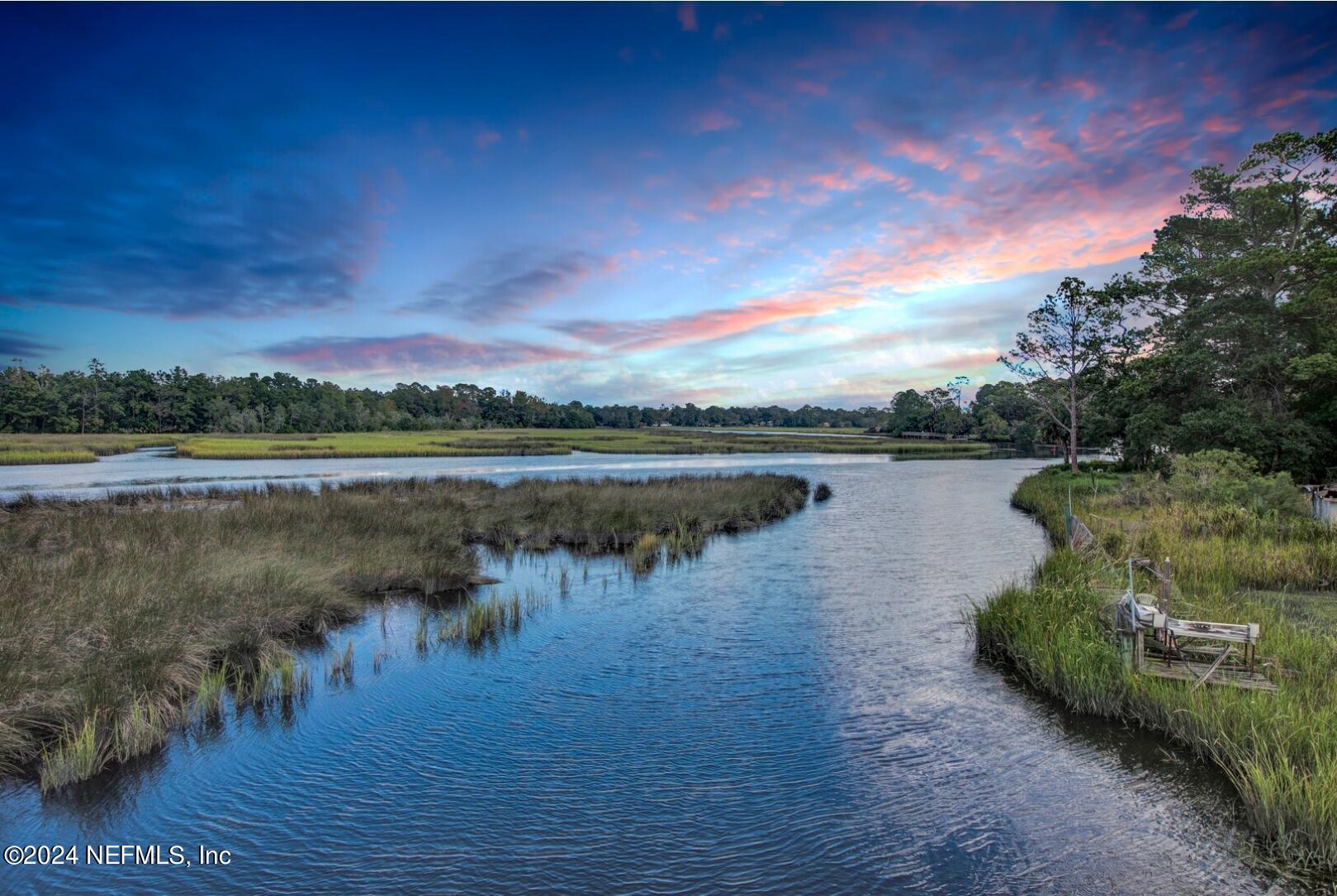 2907 Ribault Scenic Drive Jacksonville, FL 32208 - Photo 46 of 49 a view of a lake with houses in the back