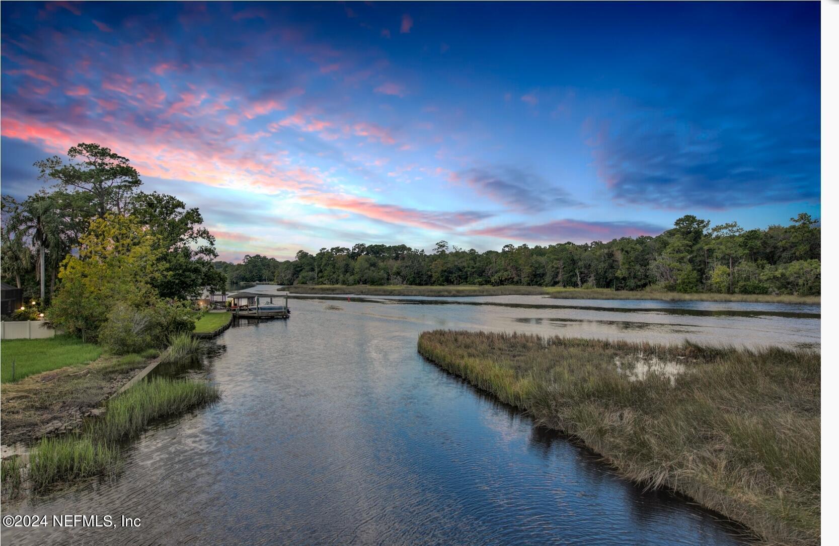 2907 Ribault Scenic Drive Jacksonville, FL 32208 - Photo 47 of 49 a view of a lake with houses in back