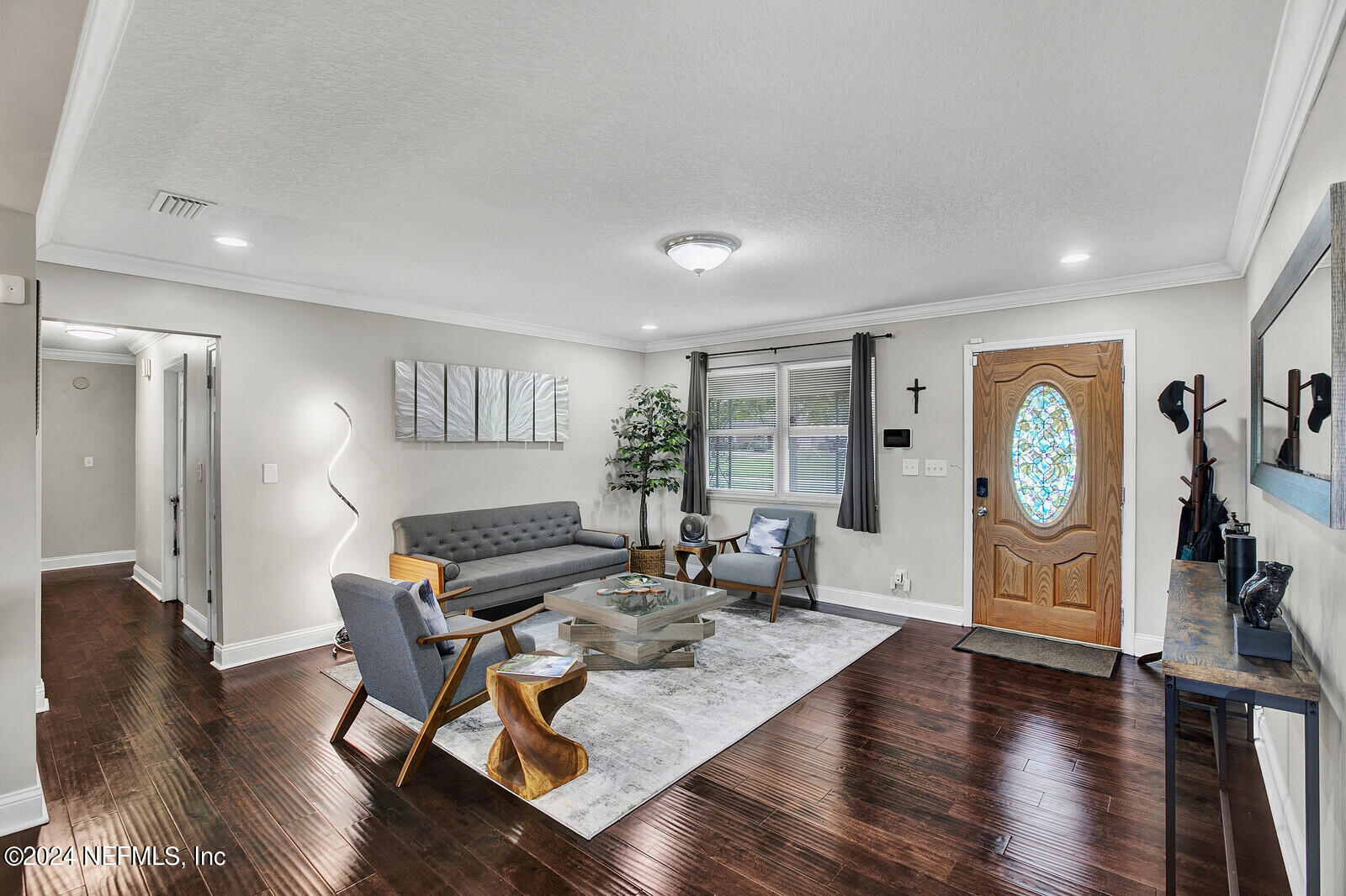 2907 Ribault Scenic Drive Jacksonville, FL 32208 - Photo 7 of 49 a living room with furniture and wooden floor