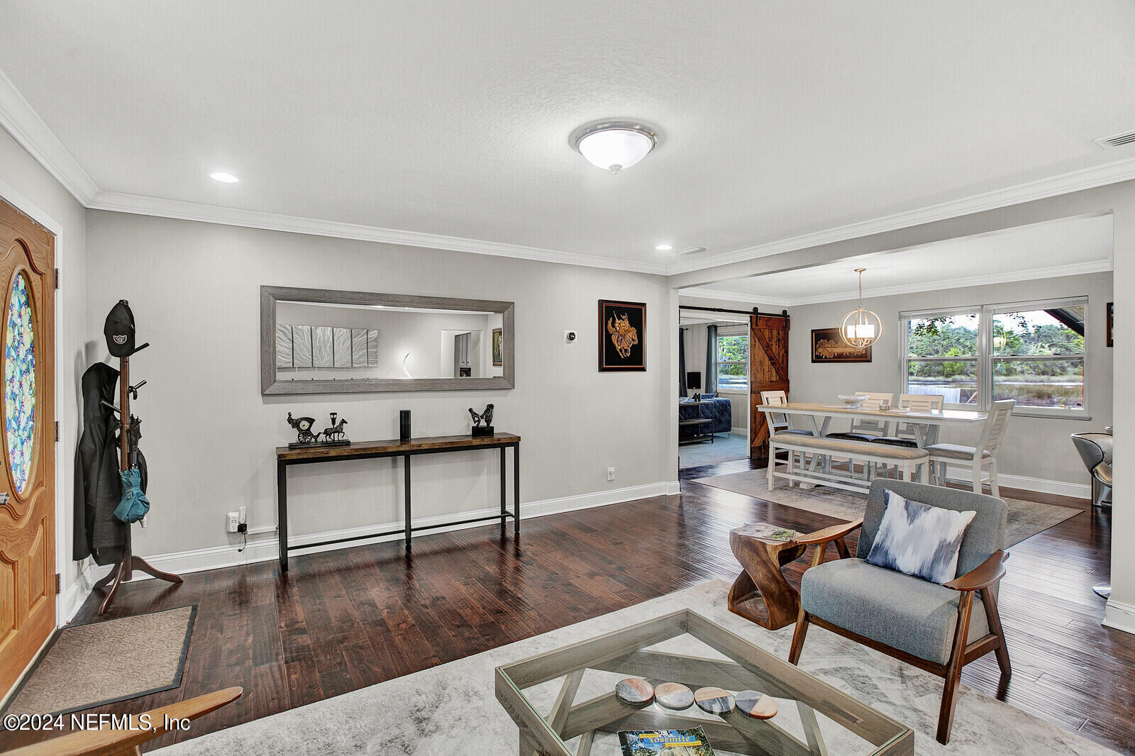 2907 Ribault Scenic Drive Jacksonville, FL 32208 - Photo 8 of 49 a living room with furniture and a wooden floor