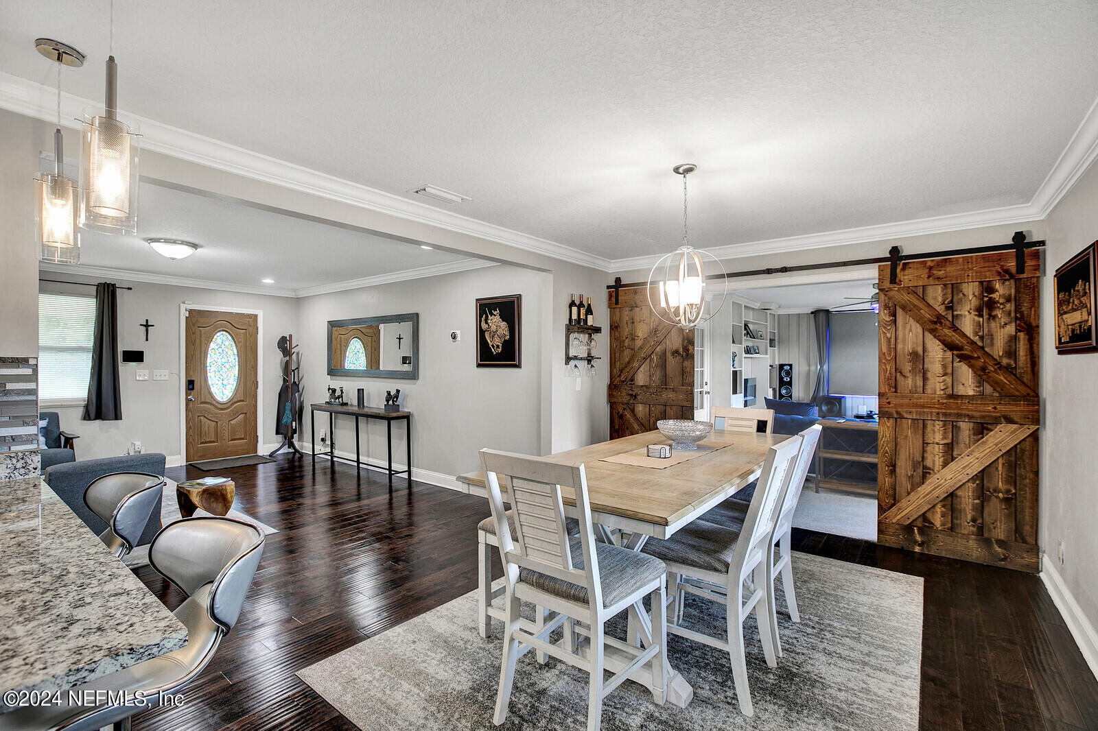 2907 Ribault Scenic Drive Jacksonville, FL 32208 - Photo 10 of 49 a view of a dining room with furniture window and wooden floor