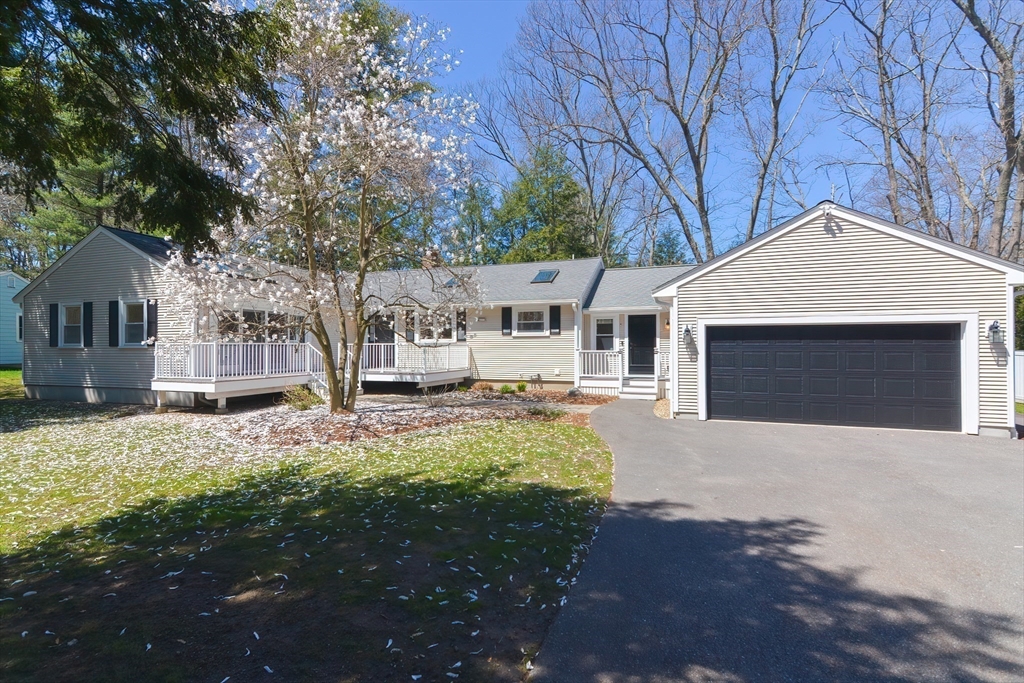 2054 Main Street Concord, MA 01742 - Photo 1 of 41 a front view of a house with a yard and garage