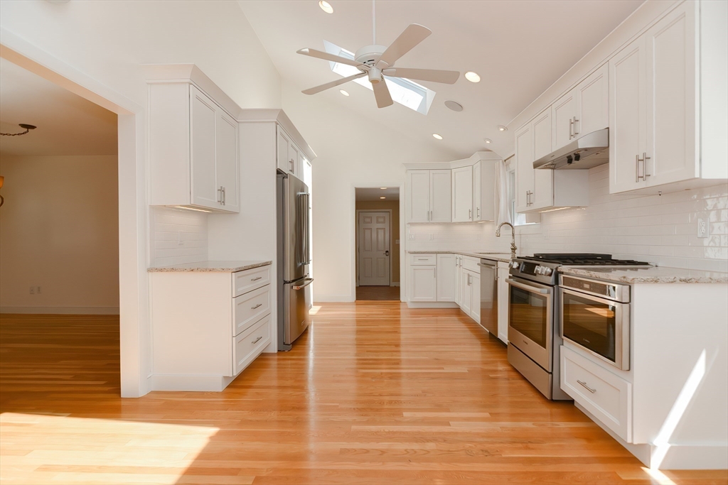 2054 Main Street Concord, MA 01742 - Photo 13 of 41 a kitchen with stainless steel appliances a stove a refrigerator and a refrigerator