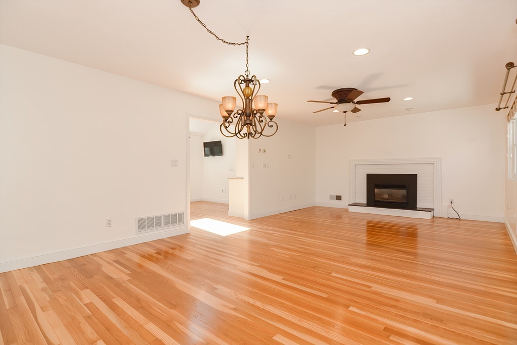 2054 Main Street Concord, MA 01742 - Photo 19 of 41 a view of empty room with wooden floor and fan