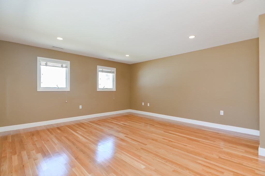 2054 Main Street Concord, MA 01742 - Photo 24 of 41 a view of an empty room with wooden floor and a window