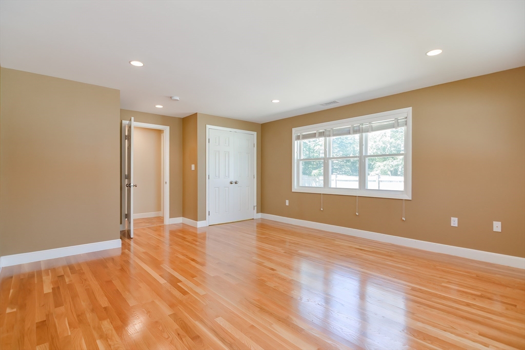 2054 Main Street Concord, MA 01742 - Photo 26 of 41 a view of an empty room with wooden floor and a window