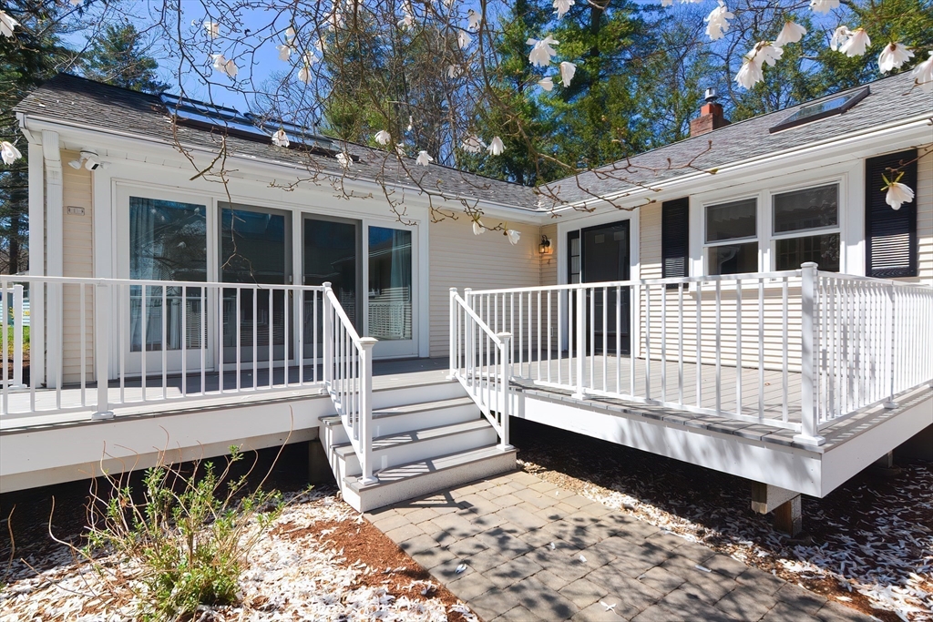 2054 Main Street Concord, MA 01742 - Photo 3 of 41 a view of a wooden deck with a bench