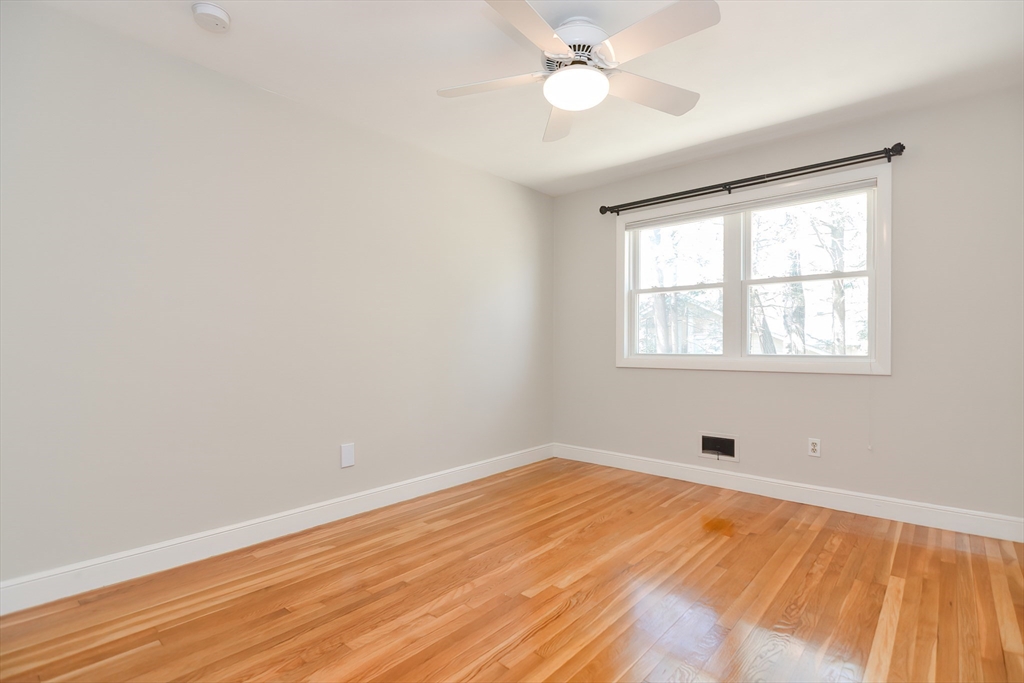2054 Main Street Concord, MA 01742 - Photo 35 of 41 wooden floor in an empty room with a window