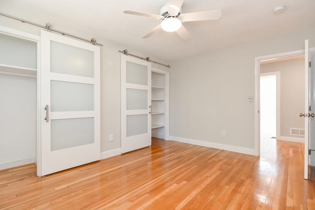 2054 Main Street Concord, MA 01742 - Photo 36 of 41 a view of an empty room with wooden floor